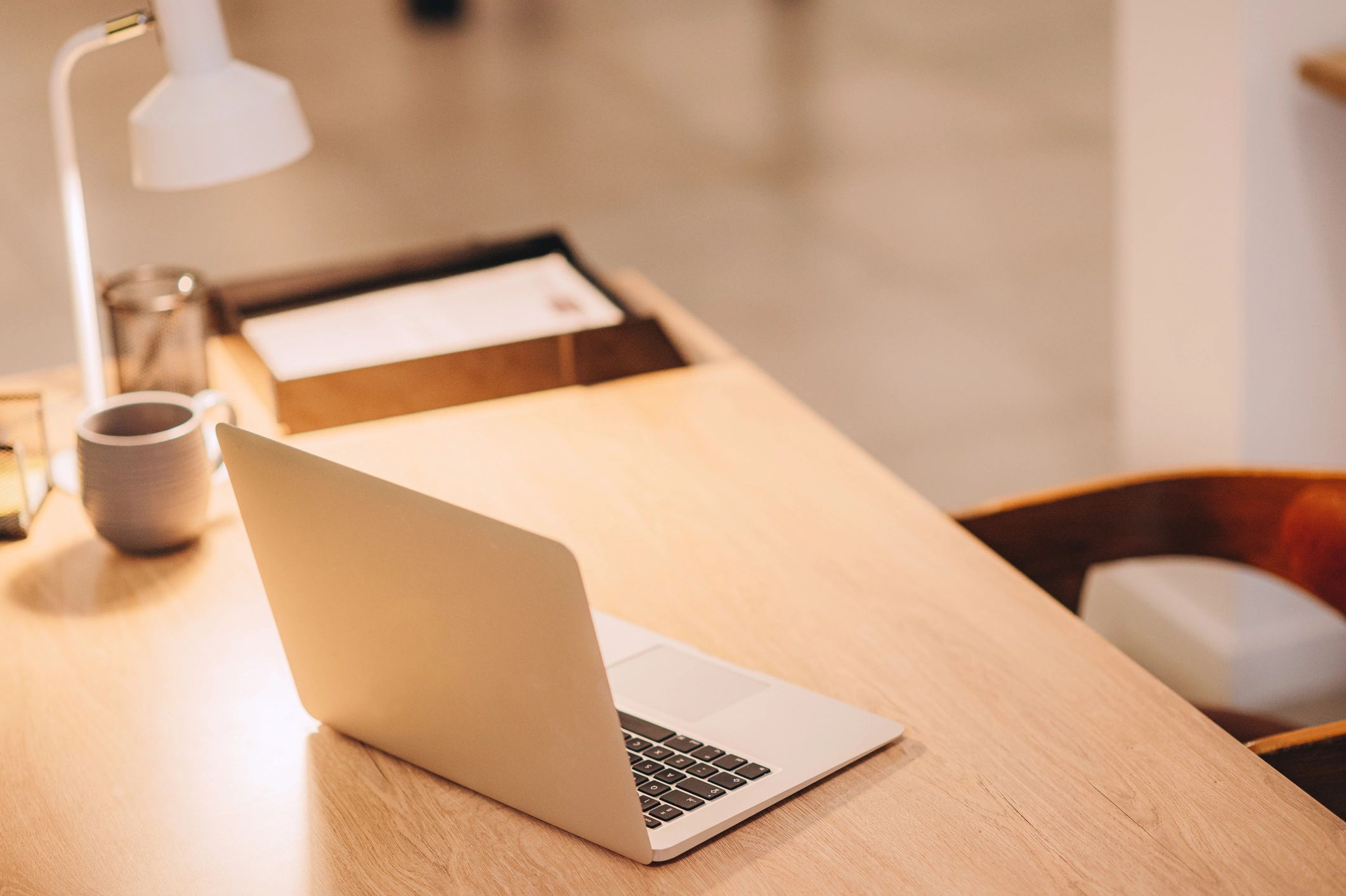 Premium branding studio workspace with laptop and creative desk
